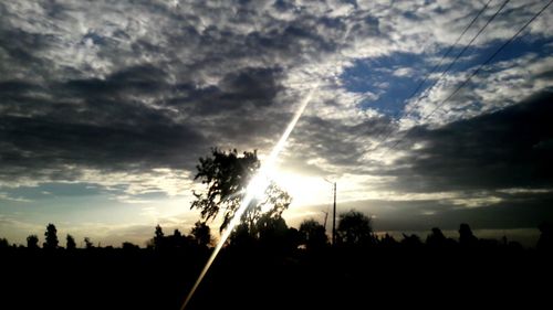 Low angle view of silhouette trees against sky during sunset