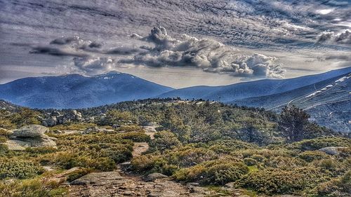 High angle view of snowcapped mountains against sky