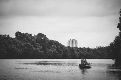 Young man boating in lake