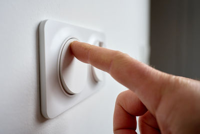 Cropped hand of person holding equipment