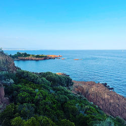 Scenic view of sea against clear blue sky