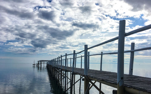 Pier over sea against sky