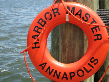 Close-up of information sign on water