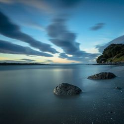 Scenic view of sea at sunset