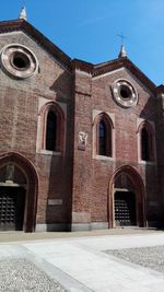 Low angle view of church against blue sky