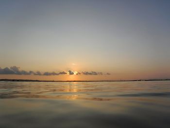 Scenic view of sea against clear sky during sunset