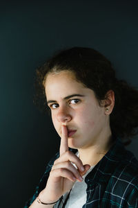 Close-up of girl against wall