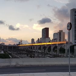 City buildings against sky during sunset