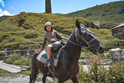 Portrait of man riding horse