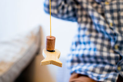 Close-up of clothespins on rope