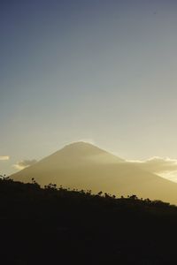 Scenic view of silhouette mountains against sky during sunset