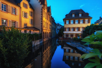Canal amidst buildings in city