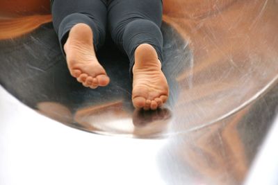 Low section of woman on slide