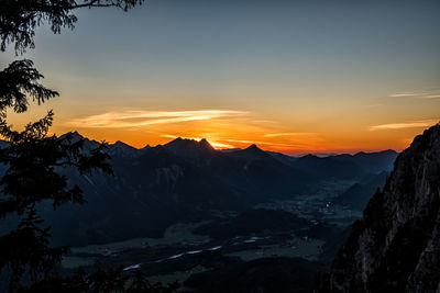 Scenic view of mountains against sky during sunset