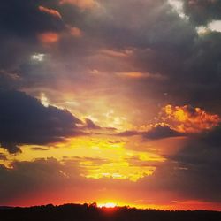 Low angle view of dramatic sky during sunset