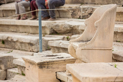 Low section of person standing on staircase