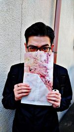 Portrait of young man using mobile phone