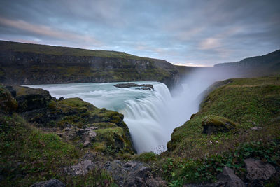 Scenic view of gullfoss waterfall against sky