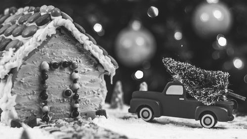 Close-up of toy car on christmas tree during winter