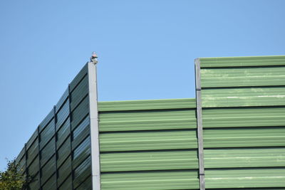 Low angle view of building against clear blue sky