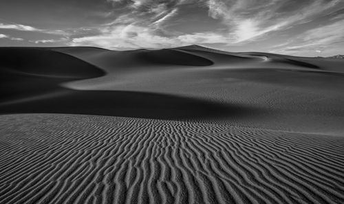 Scenic view of desert landscape against sky