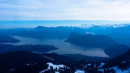Scenic view of mountains against sky during winter