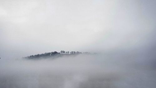 Scenic view of fog against sky