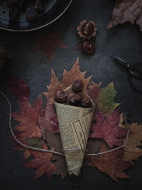 High angle view of maple leaf on table