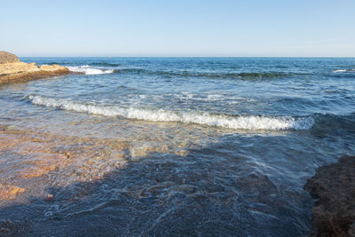 Scenic view of sea against clear sky