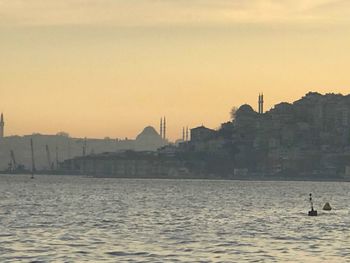 Silhouette of buildings at waterfront