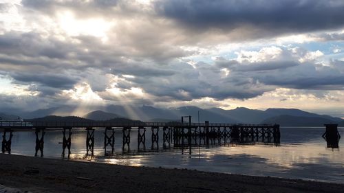 Pier over sea against sky