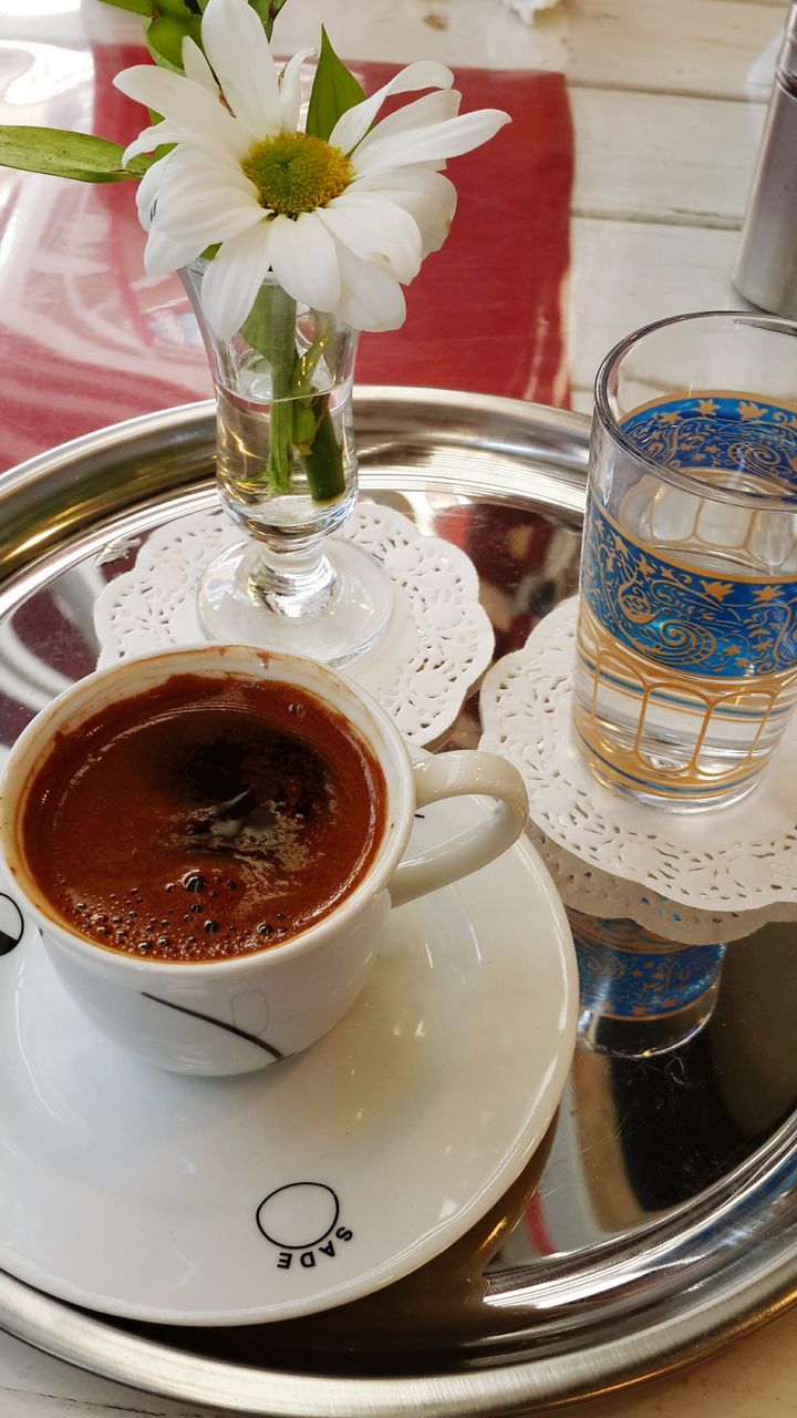 drink, food and drink, indoors, refreshment, freshness, table, coffee cup, coffee - drink, saucer, still life, drinking glass, cup, close-up, high angle view, spoon, coffee, glass - material, frothy drink, tea cup, sweet food