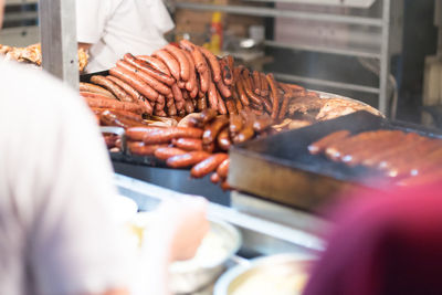 Man working on barbecue grill