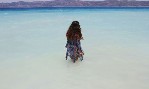 Rear view of woman in sea