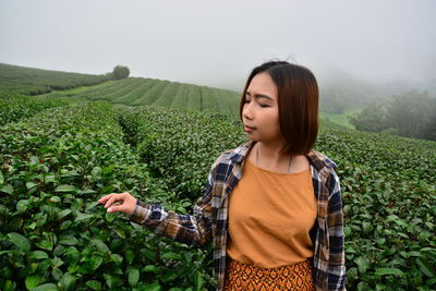 Beautiful young woman in a field