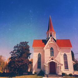 Low angle view of building against blue sky