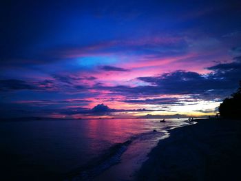 Scenic view of dramatic sky over sea during sunset