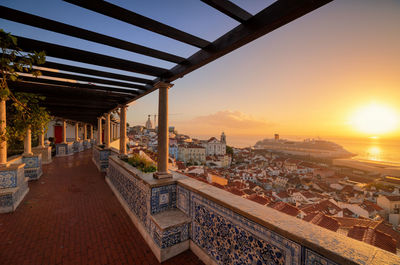 High angle view of buildings against sky during sunset