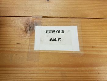 Close-up of text on wooden door