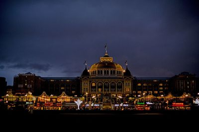 Illuminated building against sky at night