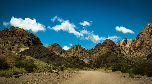 Panoramic view of road amidst mountains against sky