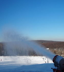 Scenic view of snow covered mountain against clear sky