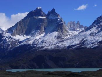 Scenic view of snowcapped mountains against sky