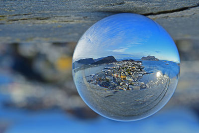 Close-up of crystal ball on glass