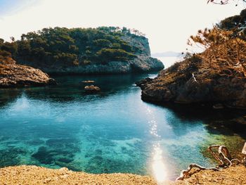 Scenic view of bay against clear sky