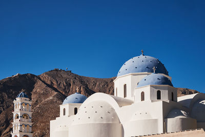 Low angle view of church against clear blue sky