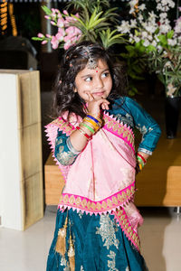 Portrait of a smiling girl standing outdoors