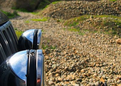 Cropped image of car on field