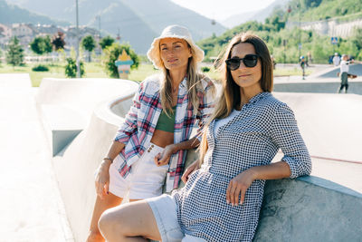 Two stylish hipster caucasian women outdoors.