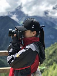 Close-up of girl photographing